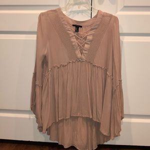 A blush pink long sleeve with a crisscross top!